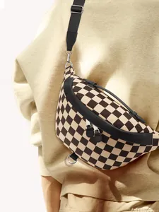 Detail showing the checkered canvas chest bag with black leather trim and silver zipper
