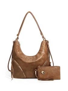 Detail of dark brown faux leather hobo bag set with matching wristlet and zippers