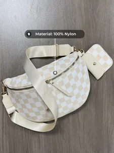 Macro view of checkered crescent crossbody bag with 100% nylon material label detail