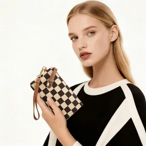 Vintage checkered clutch bag with wrist strap and golden clasp for women, white background
