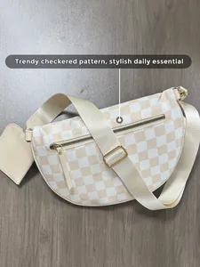 Detail view of checkered half-moon crossbody bag with detachable square coin purse accessory