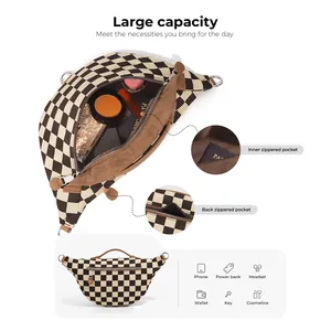 Checkerboard canvas sling bag with large capacity pockets and durable metal D-rings