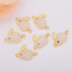 Six pieces of golden rabbit-shaped DIY bracelet connectors with pink jade-like stone