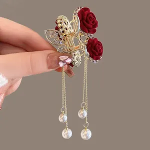Elegant gold hair claw with red velvet roses, rhinestones and pearl tassels pendant