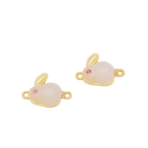 Detail of rabbit jewelry connectors in gold finish with white beads for DIY bracelets