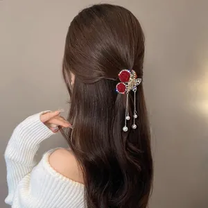 Elegant red flocked rose hair claw clip with golden butterfly and pearl fringe tassel