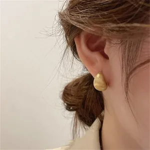 French vintage matte gold drop earrings with a textured geometric bean design for women