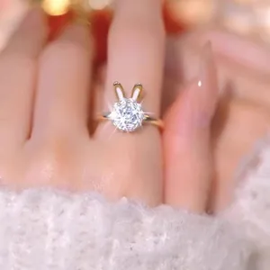 Golden rabbit shaped ring with sparkling round zircon stone worn by a female model