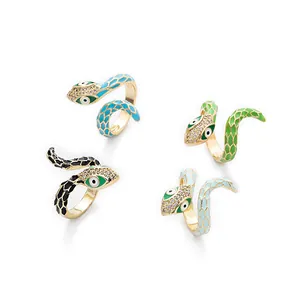 Detailed macro view of four colorful enamel snake rings with sparkling zircon pavé setting