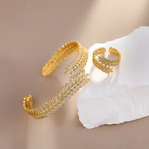 Leaf design gold plated jewelry set with zircon crystals featuring bracelet and ring