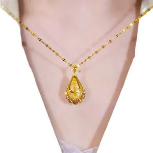 Elegant gold hollow teardrop pendant necklace for women with luxury filigree design