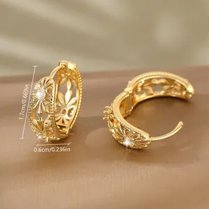 Elegant gold hollow flower hoop earrings with zircon accents and vintage vine patterns