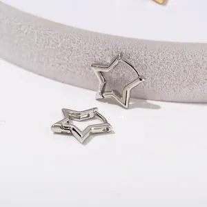 Minimalist silver star hoop earrings for women shown on a professional display stand