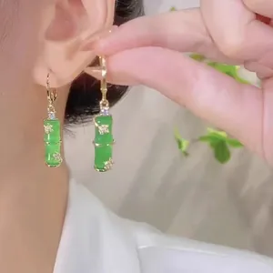 Vintage green bamboo-shaped drop earrings with gold leaves and sparkling zircon