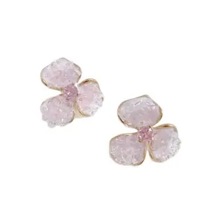 Exquisite pink stone flower stud earrings with gold trim and crystal centers on white back