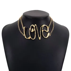 Elegant gold-tone Love script letter necklace pendant on a minimalist thin chain