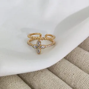 Adjustable gold plated double layer ring with clover zircon and beaded textured band