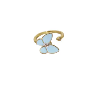 Adjustable gold butterfly ring with light blue enamel and sparkling marquise zircon stone