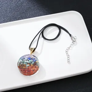Chakra gemstone pendant necklace with resin layers and adjustable black cord strap
