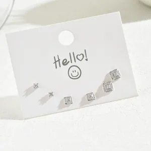 Elegant silver earring set featuring star and bow designs with cubic zirconia accents