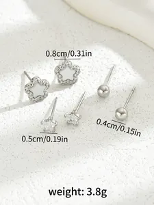 Detailed view of silver star, flower, and bead stud earring set with size dimensions