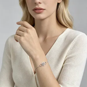 Elegant 925 sterling silver infinity heart bracelet with cubic zirconia on woman wrist