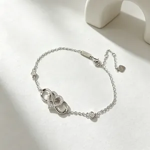 925 Sterling silver infinity heart bracelet with sparkling cubic zirconia on a white background