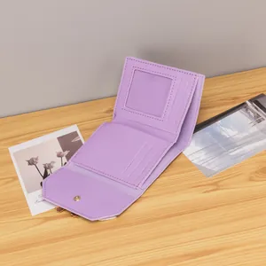 Detail view of lavender PU leather tri-fold wallet with card slots and metal snap closure