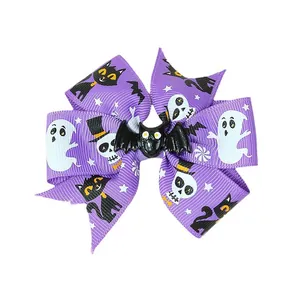 Purple Halloween bow hair clip featuring ghost and skull patterns with a black bat center