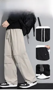 Detail view of men's casual cargo pants featuring elastic drawstring waist and side pockets
