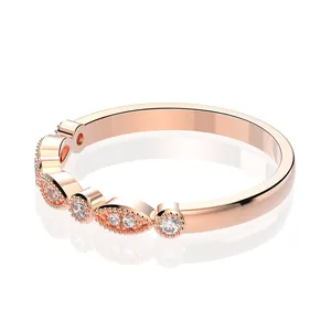 Macro view of rose gold ring with alternating marquise and round cubic zirconia settings