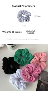 Detail showing plush towel fabric scrunchies with metallic tag and product dimensions