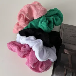 Five-piece soft plush scrunchie set in assorted pastel colors with cozy towel fabric