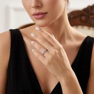 Elegant V-shaped S925 sterling silver moissanite ring with side accent diamonds on finger