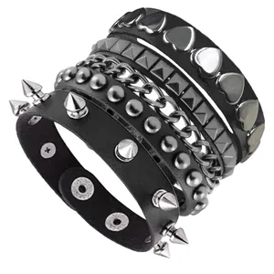 Detailed view of 5-piece punk leather bracelet set with metallic studs and chains