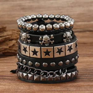 Detailed close-up of 5-piece punk set with leather, rivets and skull motifs on wood