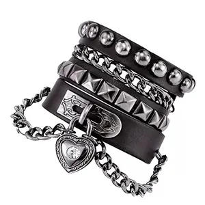 Detail of multi-layer punk leather bracelets with metal rivets and heart lock pendant