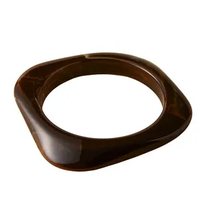 Irregular tortoise pattern resin bangle with a vintage square minimalist aesthetic