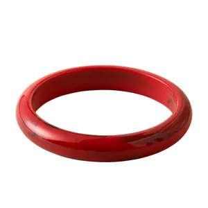 Bohemian red acrylic resin bangle with vintage marbled texture and polished finish