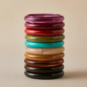 Stacked bohemian resin acrylic bangles in assorted marble textures and earthy colors