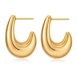 Macro shot of 18K gold plated thick U-shape earrings with a smooth polished finish