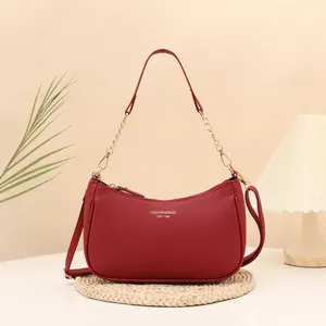 Burgundy litchi grain underarm bag with gold fashion lettering and chain strap