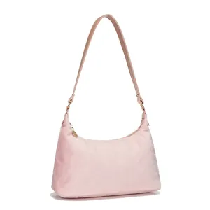 Chic pink faux fur underarm bag with smooth leather strap and sleek gold-tone hardware