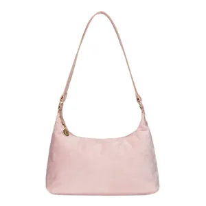 Front view of a pink faux fur baguette bag with a minimalist half-moon shape and gold charm