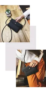 Detail of black pebbled leather crossbody bag with gold snap button and slim shoulder strap
