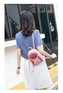 Pink mini backpack featuring sequin cat ears and adjustable thin shoulder straps