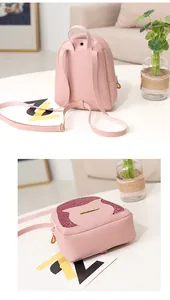Detail of pink glitter mini backpack showing back straps and metal hardware