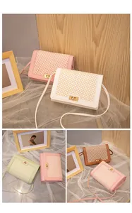 Detail of woven lattice pattern and metallic twist lock on colorful small square bags