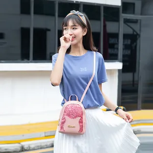 Pink sequin mini backpack for women featuring cute cat ear design and metal logo detail