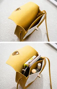 Detail view of contrast saddle bag interior showing space for phone and cosmetics